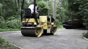 Blacktop Driveway Extension Base Install and Compaction in East Northport, New York.