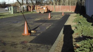 Utility Site Work Trench Repair in an asphalt parking lot in West Islip New York, Setup a safe work environment.